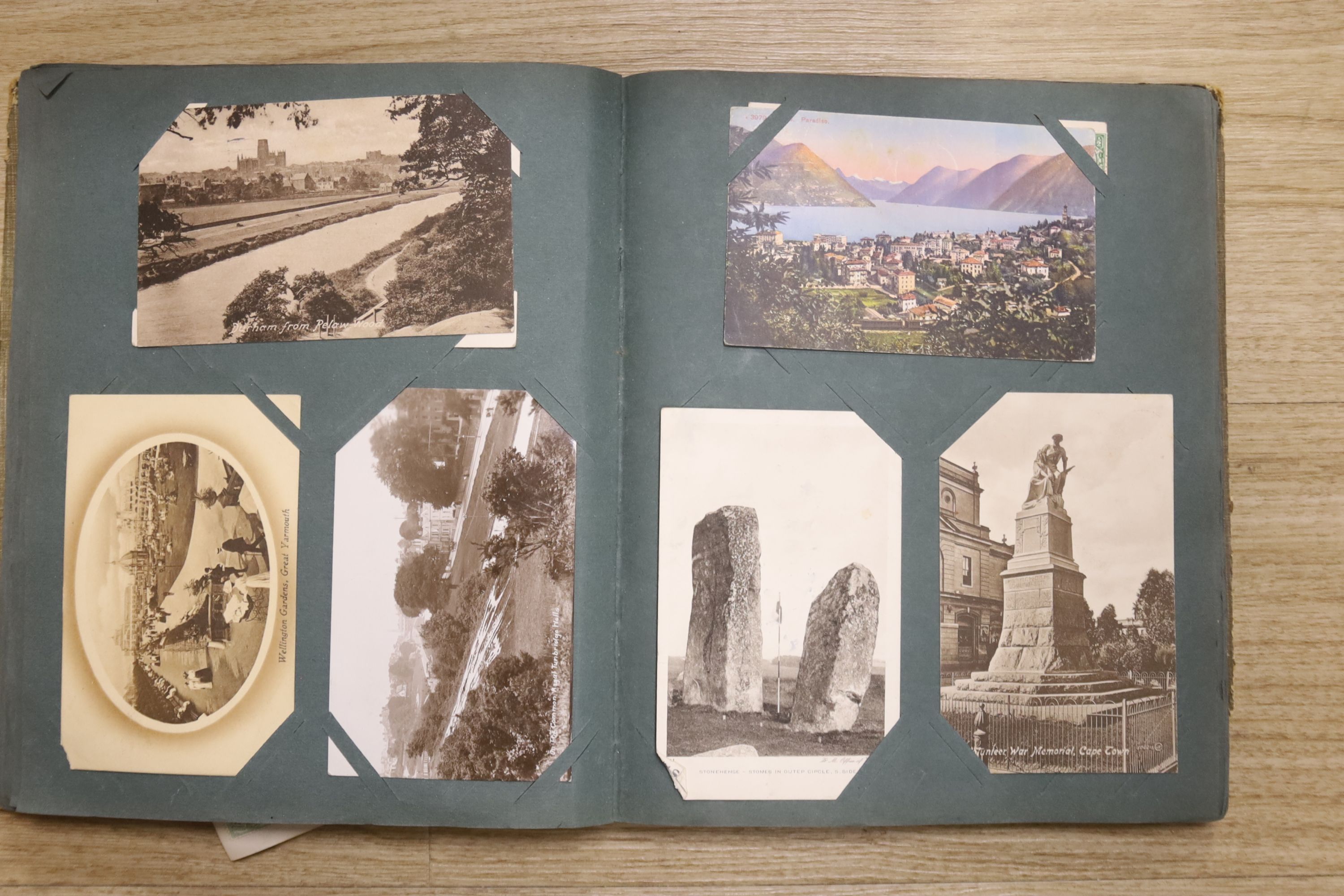 Three photograph albums and loose photos plus three postcard albums and a quantity of European currency